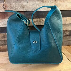 Portland Leather Goods Sea Glass Flora, brand new. Smoke free home with one pup.